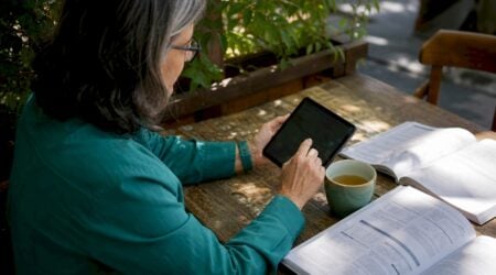 Specialist interacting with digital identity wallet tablet