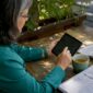 Specialist interacting with digital identity wallet tablet