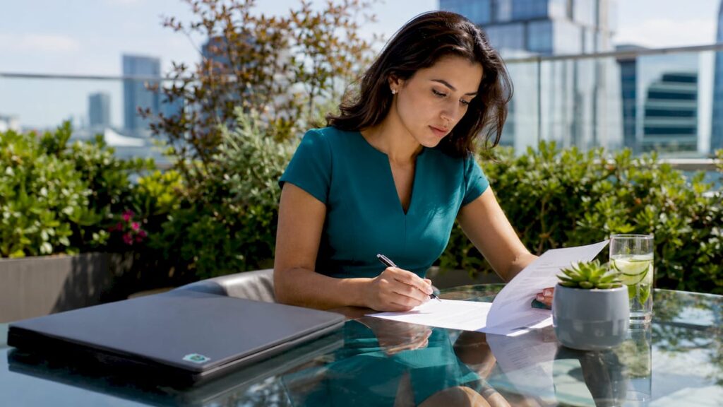 Professional reviewing consent form at desk