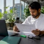 Cybersecurity analyst reviewing fraud prevention report
