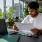 Cybersecurity analyst reviewing fraud prevention report
