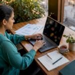Fraud analyst working at desk in modern office