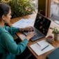 Fraud analyst working at desk in modern office