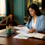 Fraud analyst reviewing eKYC compliance documents