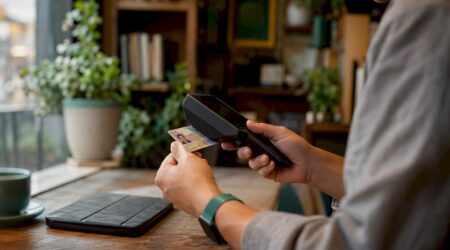 Small business owner scanning ID card