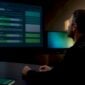 Engineer reviewing adaptive authentication signals