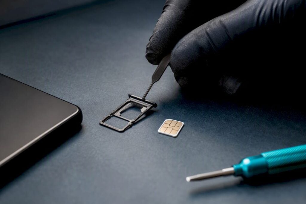 SIM tray and card on security workbench