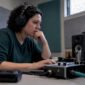 Analyst reviewing recorded call for voice cloning