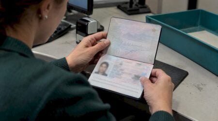 Open passport identity page under inspection