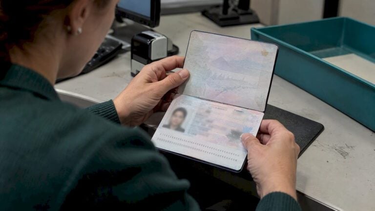 Open passport identity page under inspection