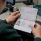 Open passport identity page under inspection