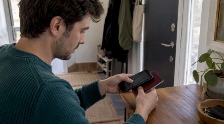 Traveler scanning an ePassport with a phone