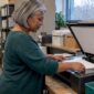 Staff member prepares a document for scanning